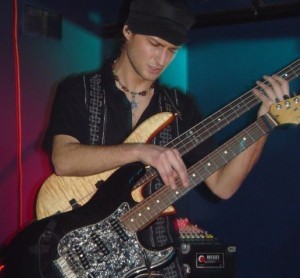 Karl-Gunther-playing-guitar-and-bass-300x278